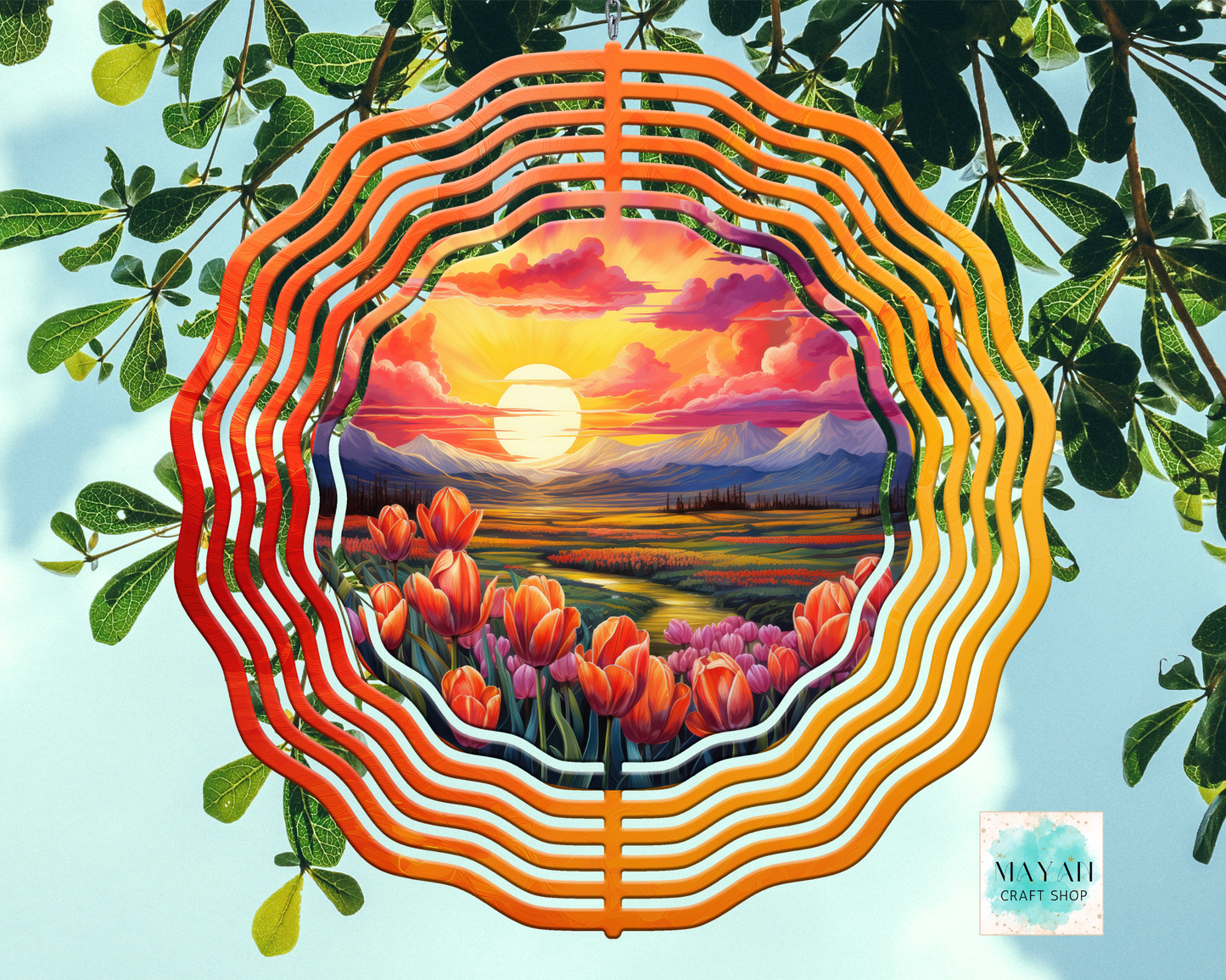 Decorative plate with sunset and flower design on a leafy background, featuring the brand 'Maya Craft Shop'.