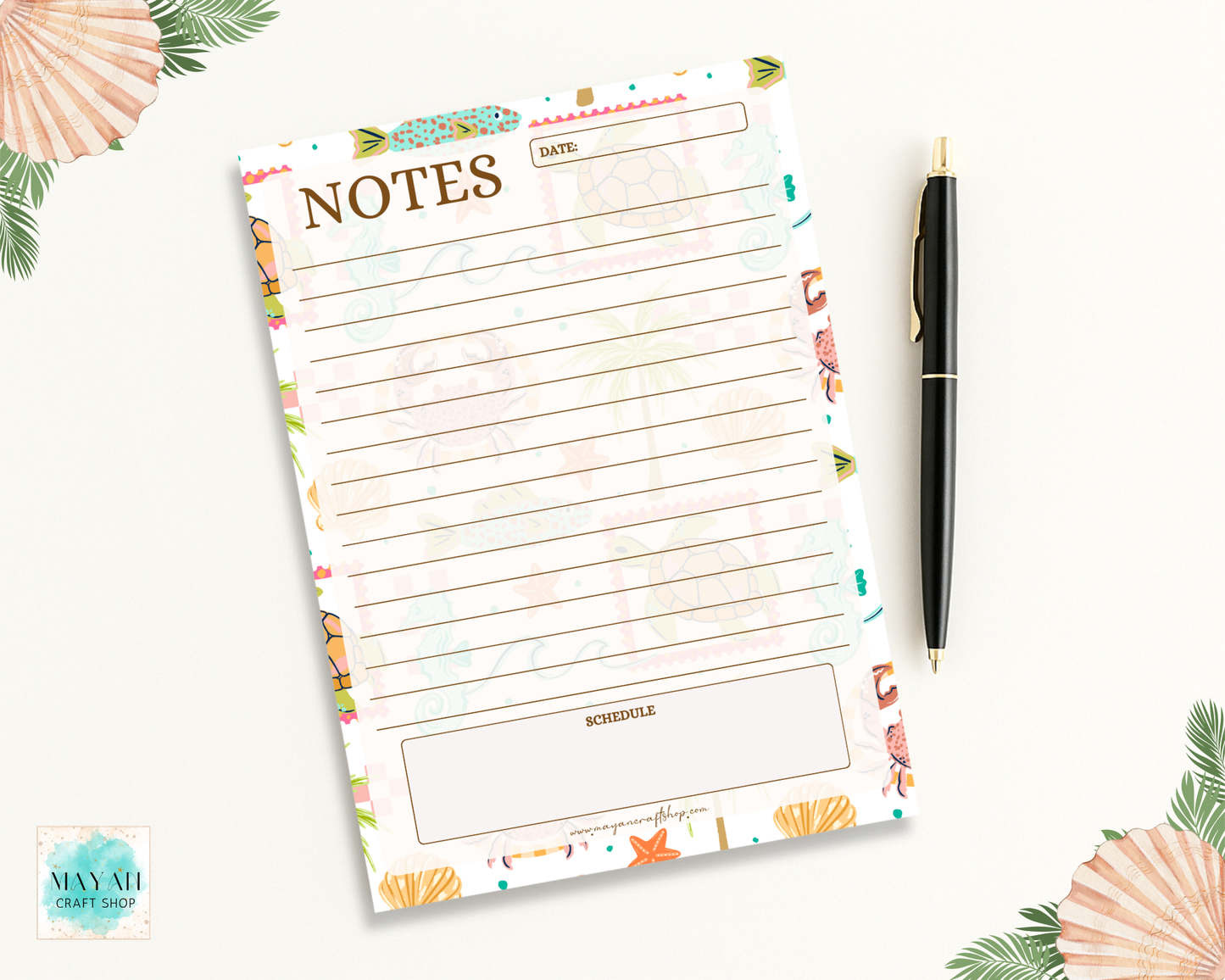 Floral notepad with a pen on a white background