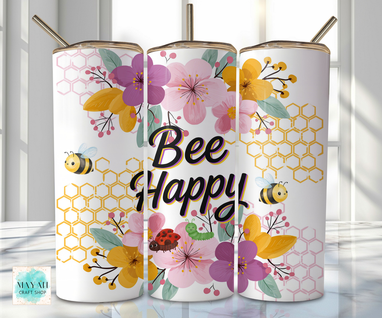 Three floral-themed tumblers with 'Bee Happy' text on a white background.