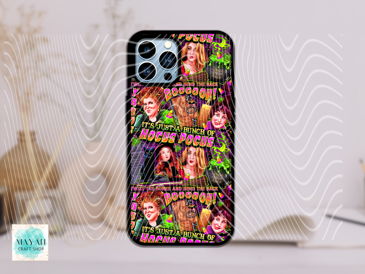 Phone case with colorful design featuring characters and text on a light background