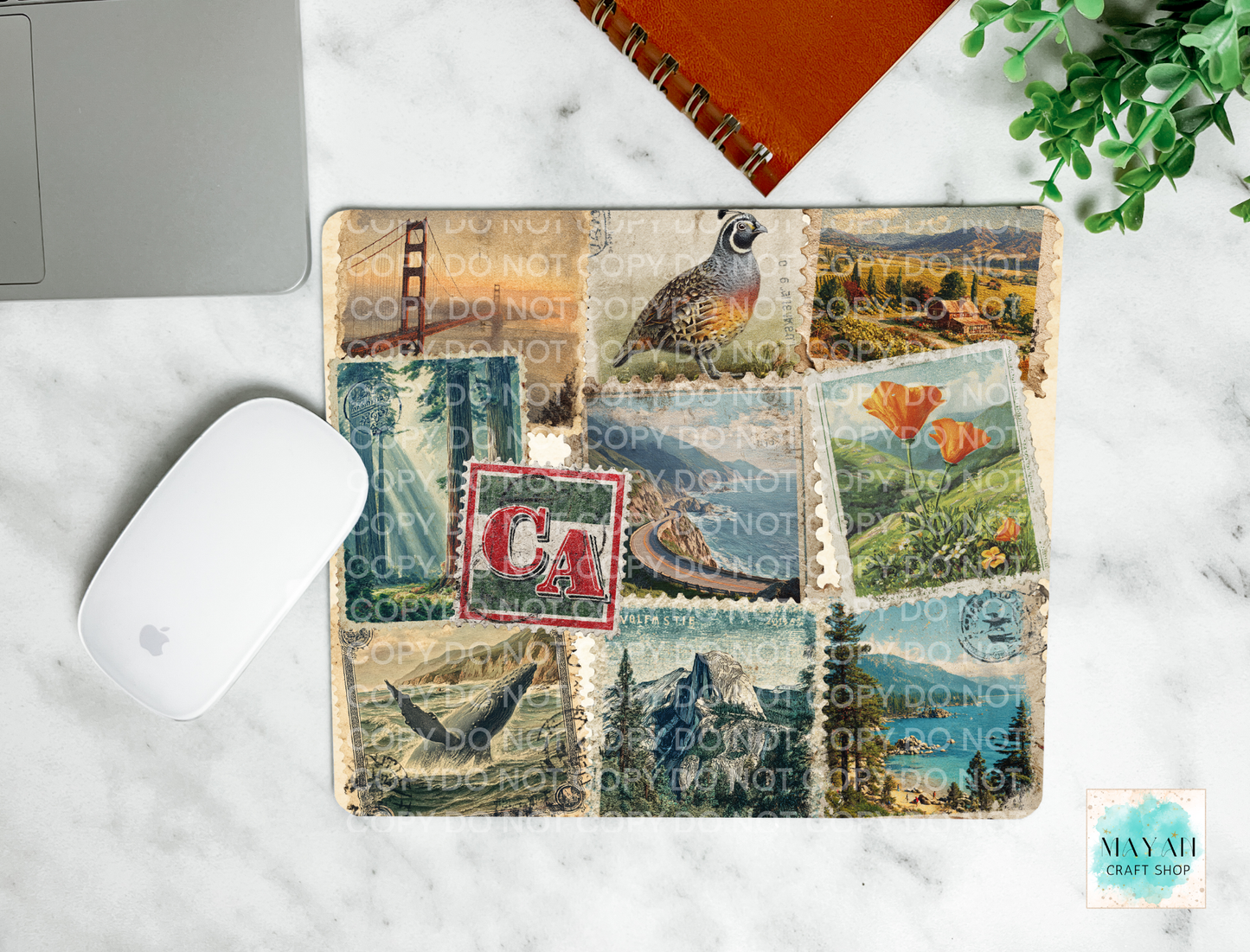 Mouse pad with nature-themed design on a marble surface
