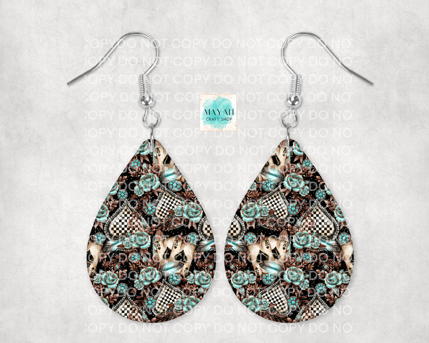Teardrop-shaped earrings with floral pattern on a light gray background
