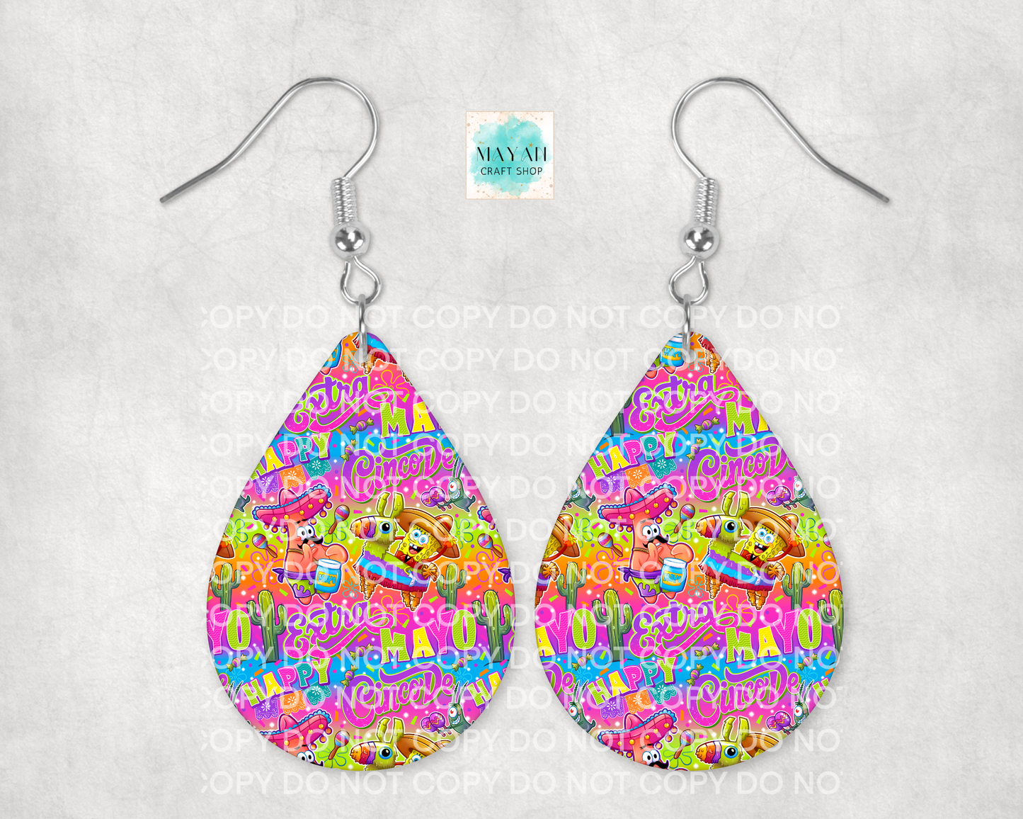 Teardrop-shaped earrings with colorful cartoon pattern on a white background