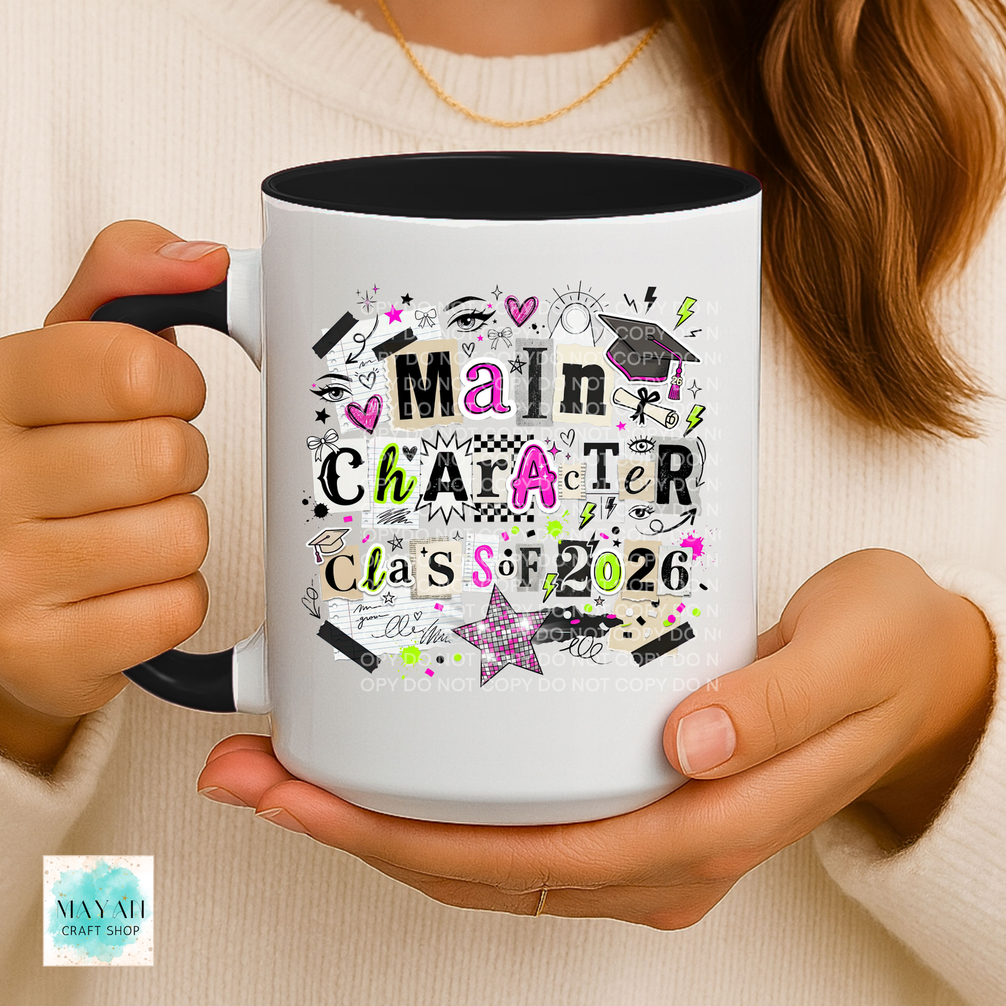 Person holding a mug with 'Main Character Class of 2026' design