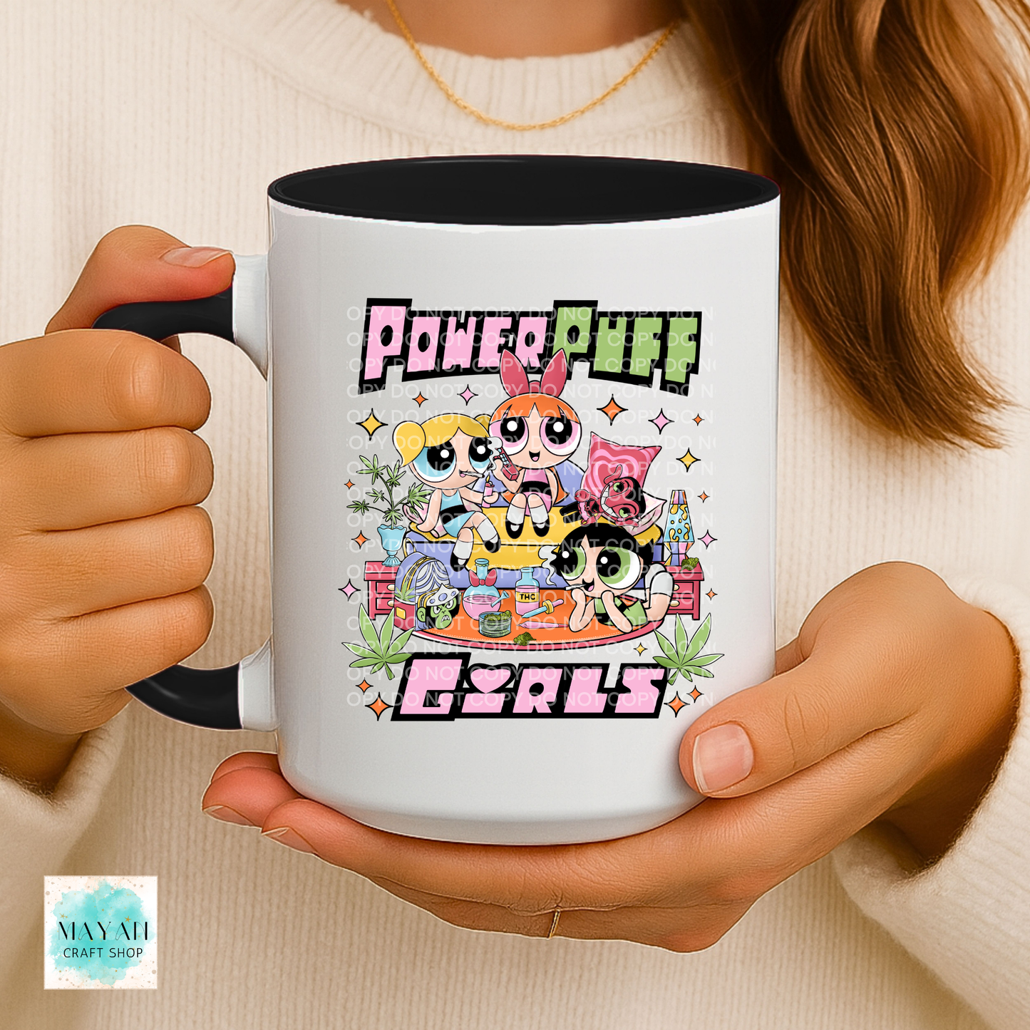 Person holding a mug with a vibrant design