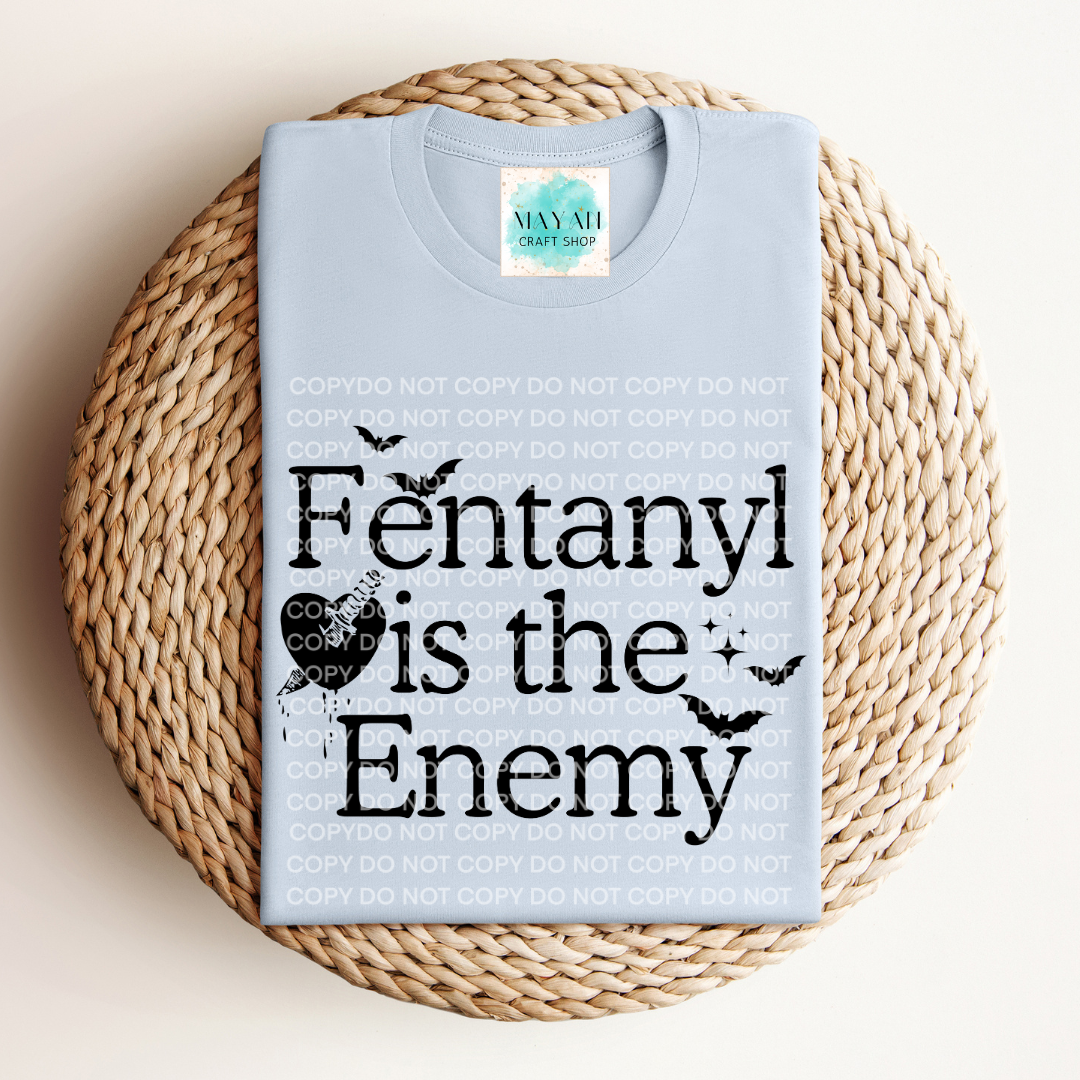 Fentanyl is the enemy light blue shirt. -Mayan Craft Shop