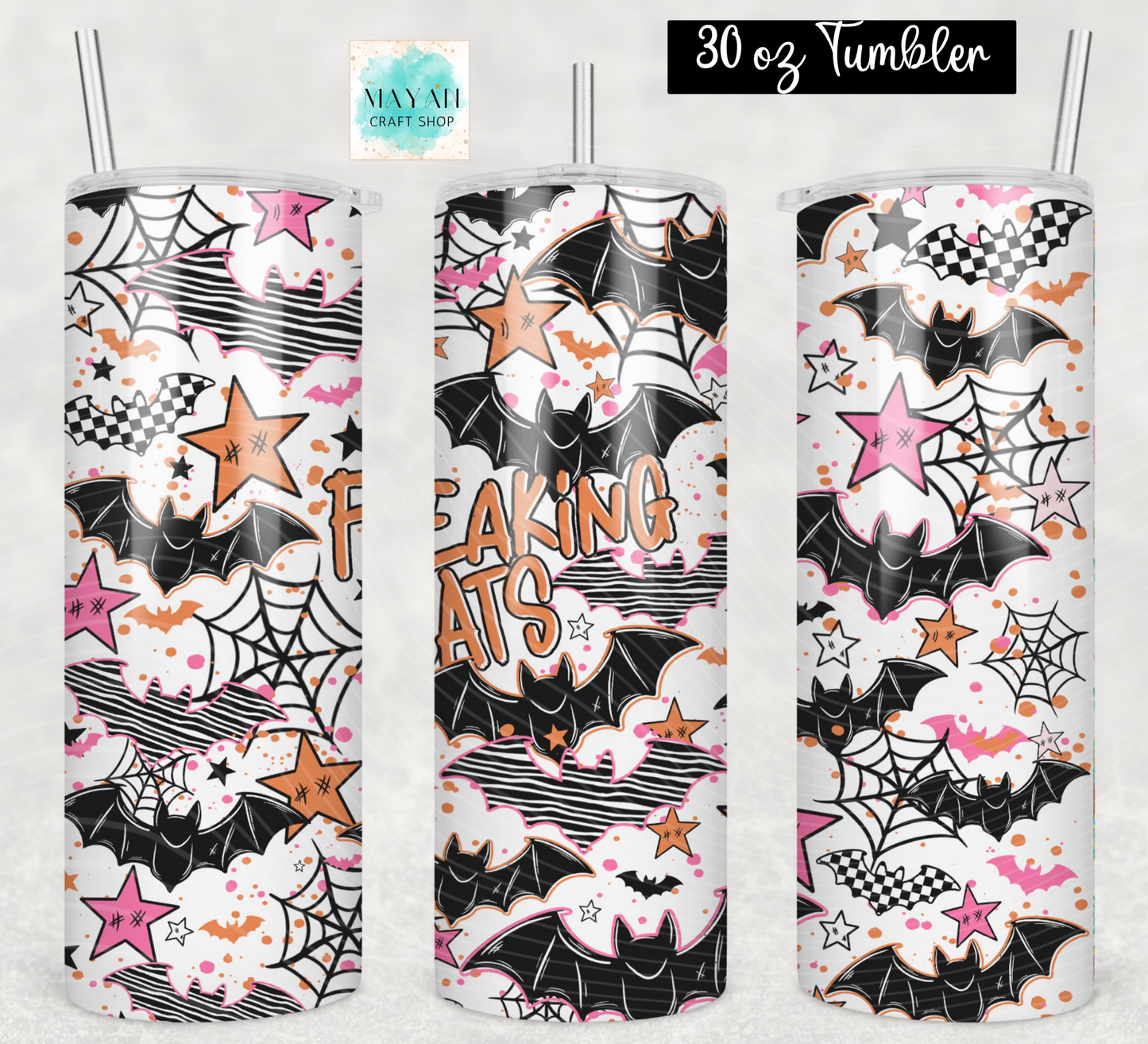 Three 30 oz tumblers with clear straws, featuring a Halloween-themed print with bats, spiderwebs, stars, clouds, and the words 'FREAKING BATS' in orange. The background is a light textured gray.