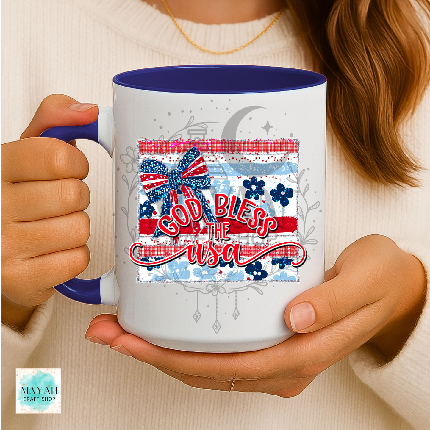 Person holding a mug with 'God Bless the USA' design