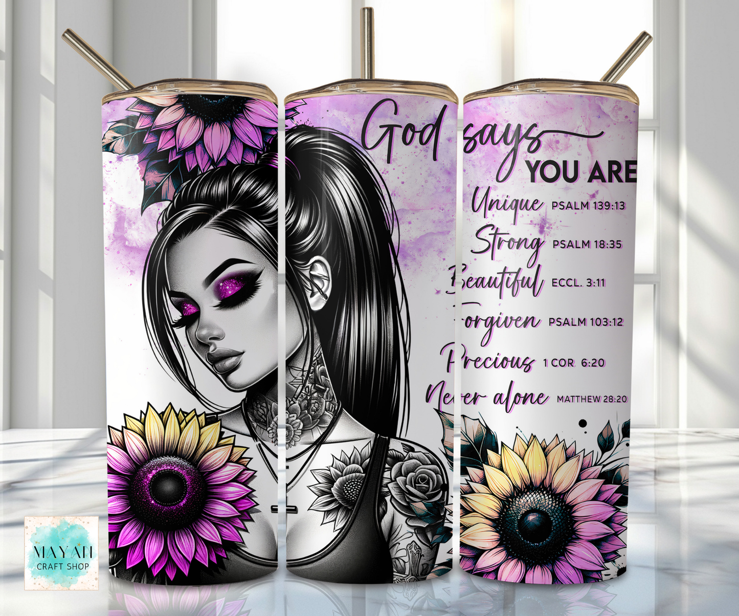Three tumblers with a design of a woman's face, flowers, and motivational text on a white background.