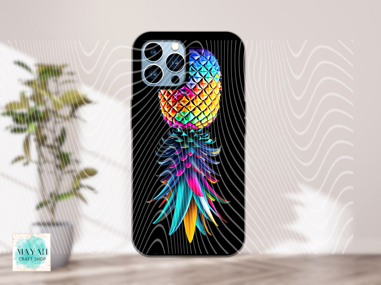 Phone case with colorful pineapple design on a black background