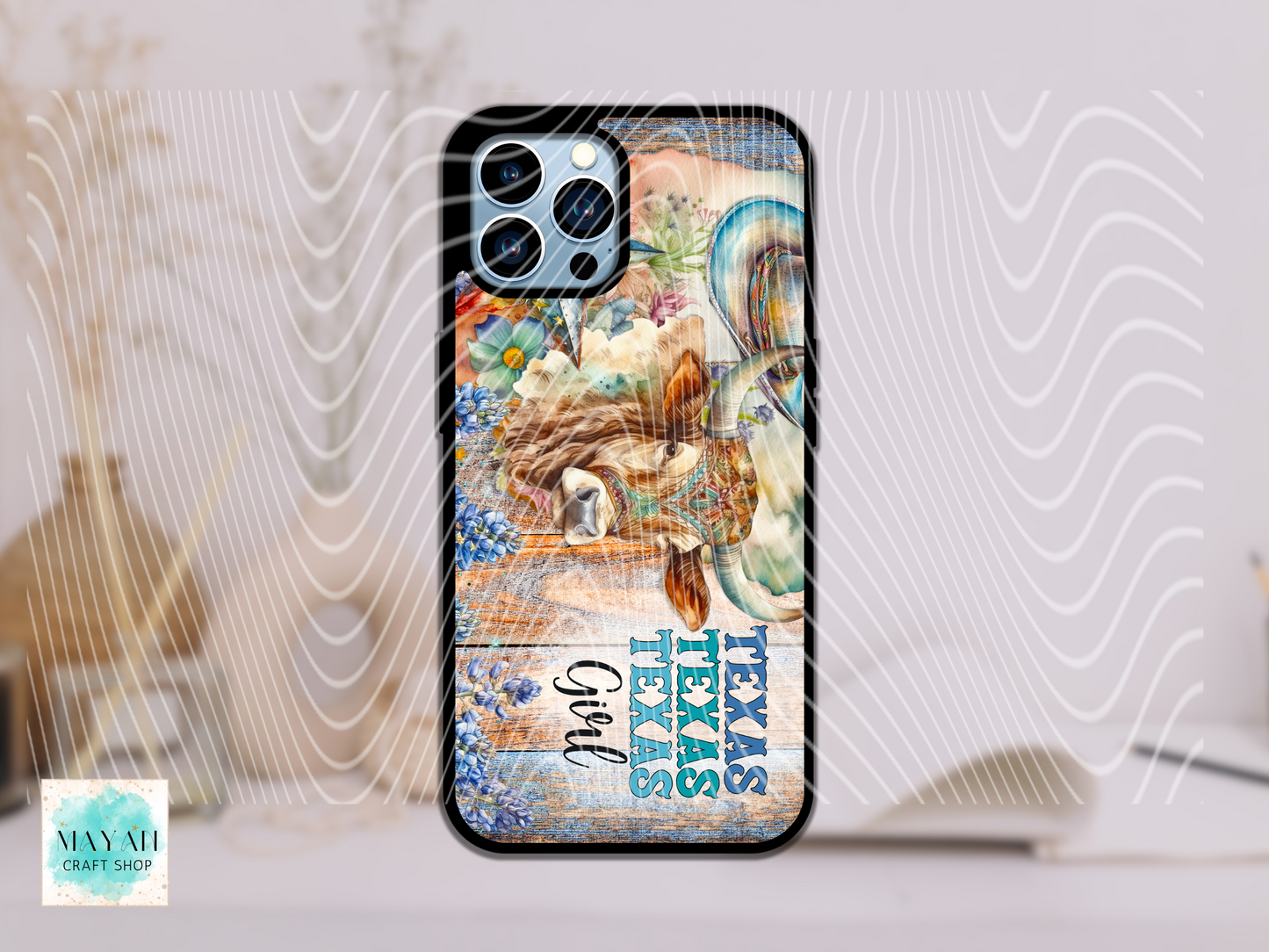 Phone case with ocean-themed design and 'Texas Girl' text on a white surface