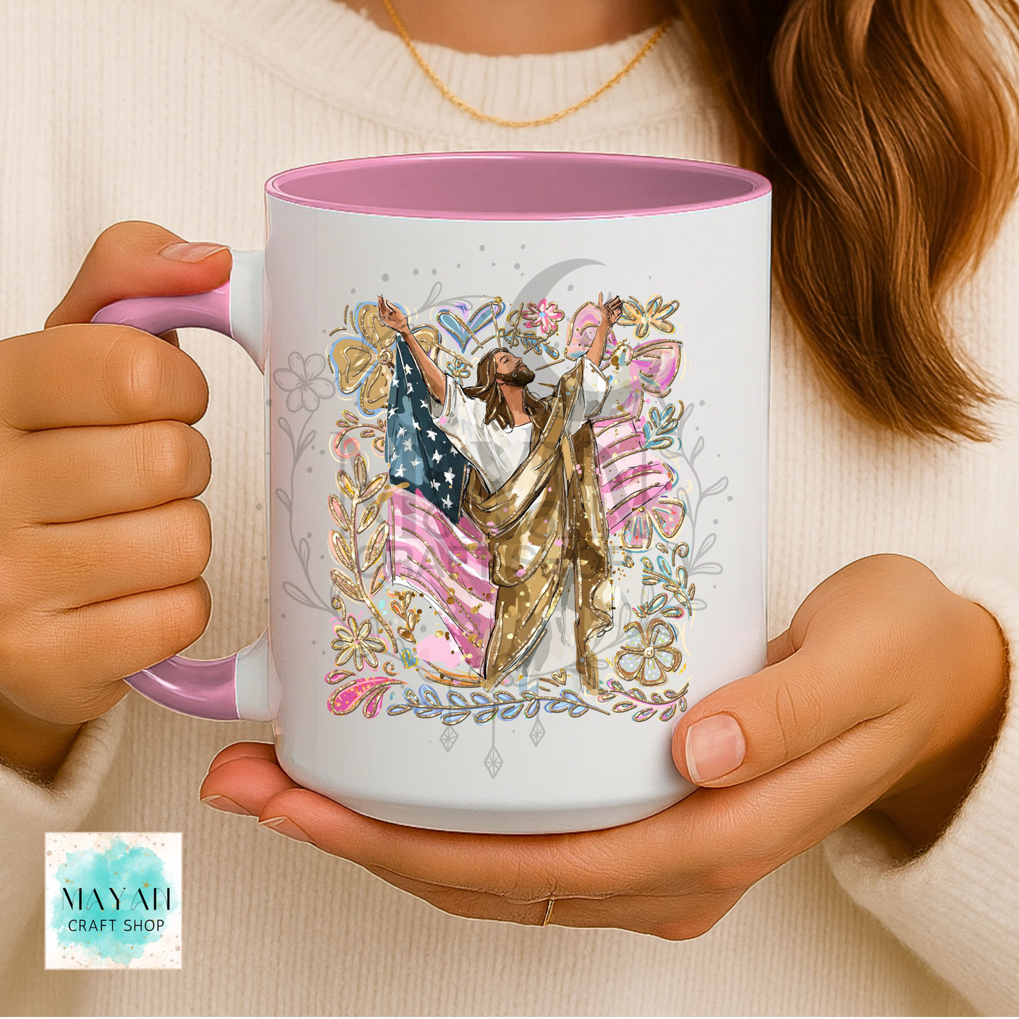 Person holding a mug with a colorful design of a person holding an American flag.
