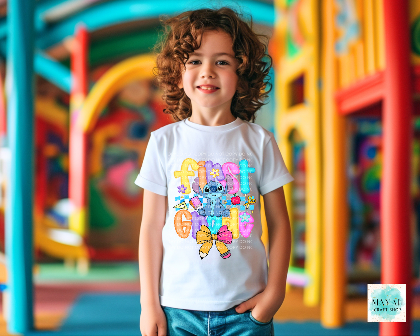 Child wearing a colorful t-shirt with cartoon character in a playground setting