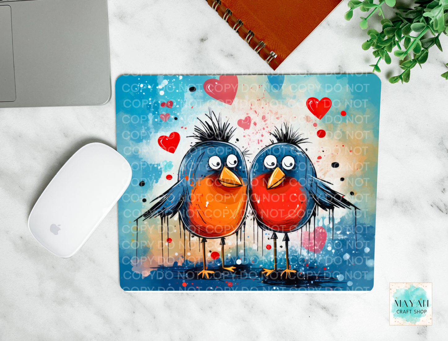 Mouse pad with cartoon birds design on a marble surface