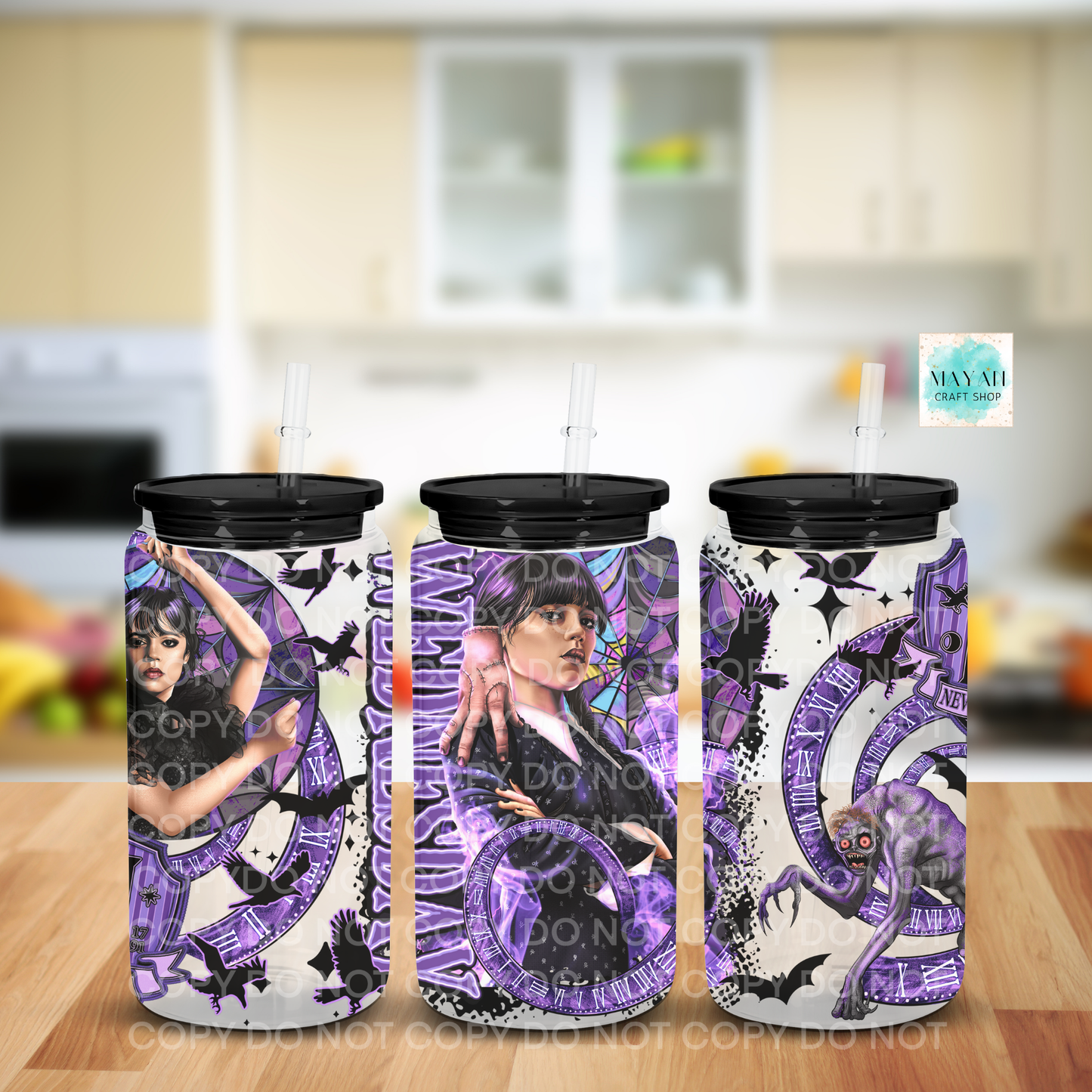 Frsoted glass can with artistic designs on a kitchen counter.
