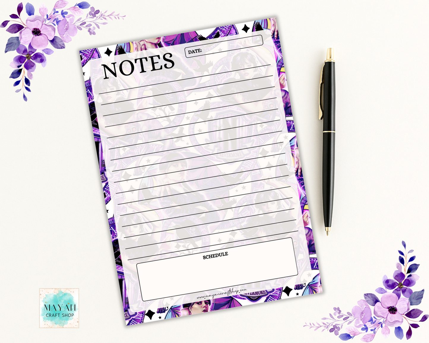 Notepad with floral border and pen on a white background