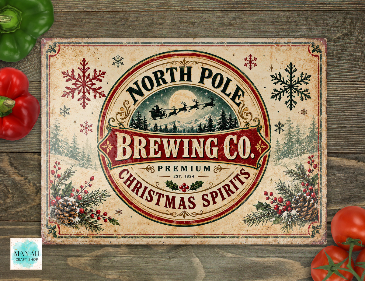 A cutting board with a rustic cream background and a large central circular emblem reading “North Pole Brewing Co. Christmas Spirits,” surrounded by red snowflakes, evergreen branches, pinecones, and holiday berries.