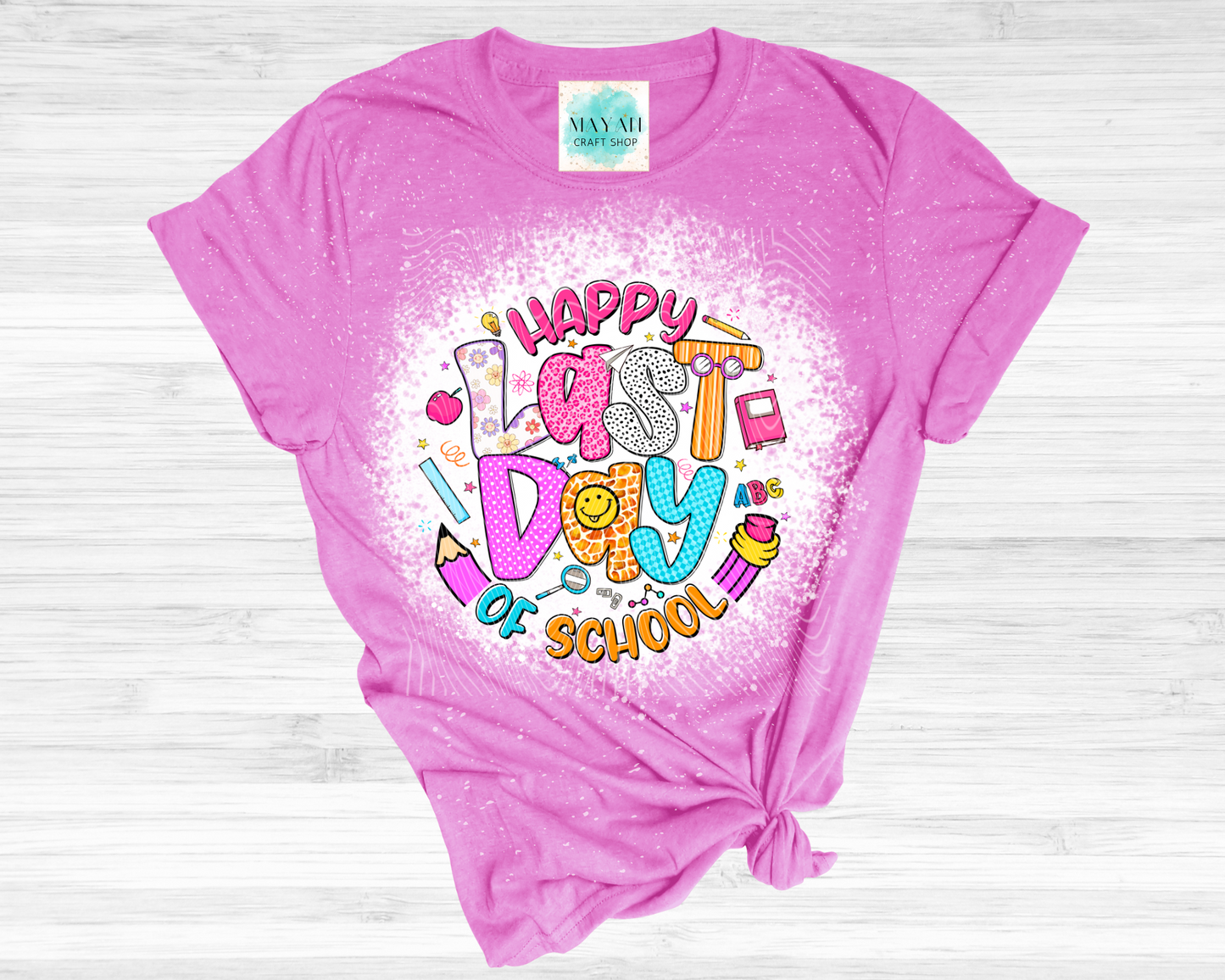 Happy last day of school heather orchid bleached tee. -Mayan Craft Shop