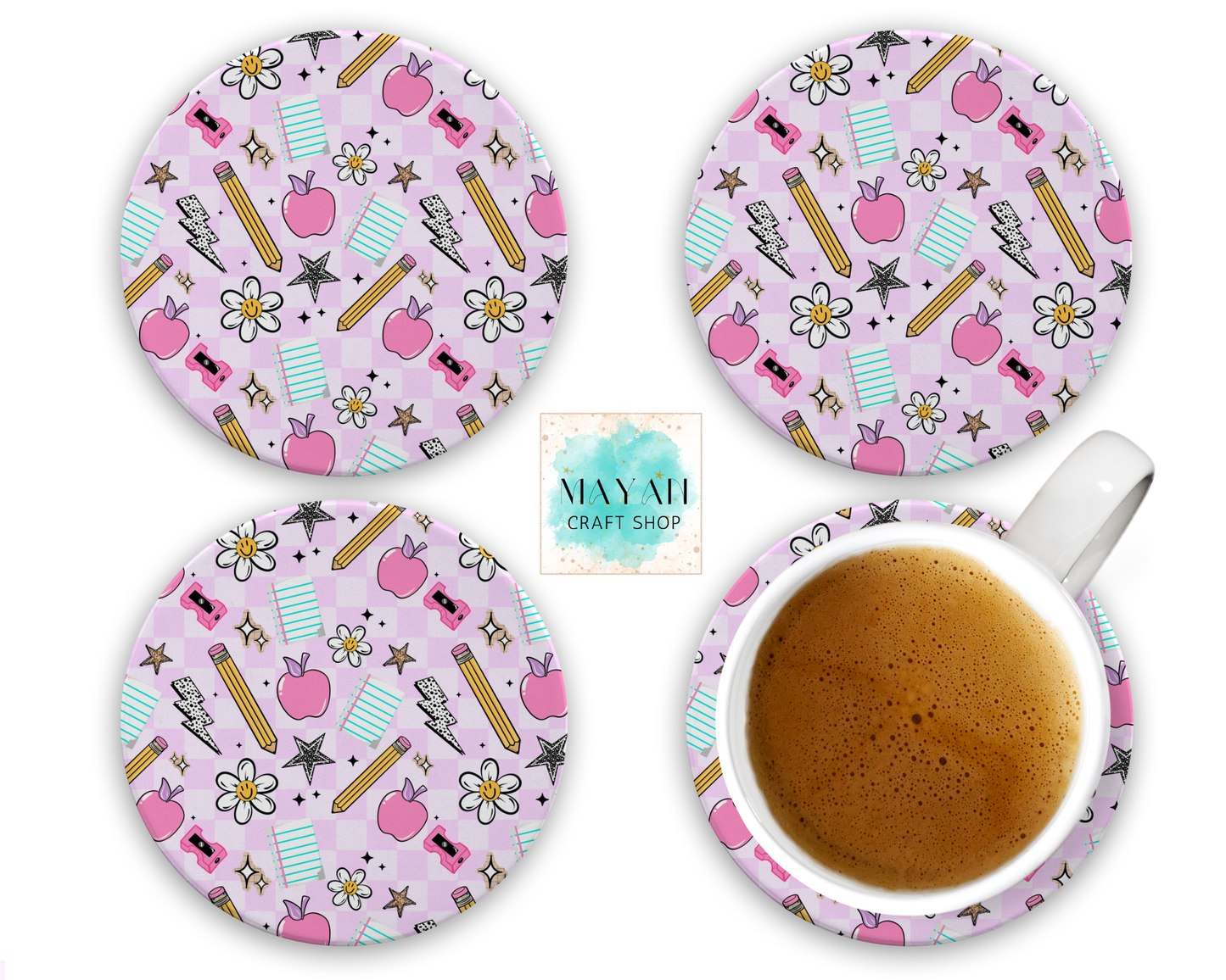 Set of four pink coasters with stationery-themed design, one coaster with a cup of coffee.