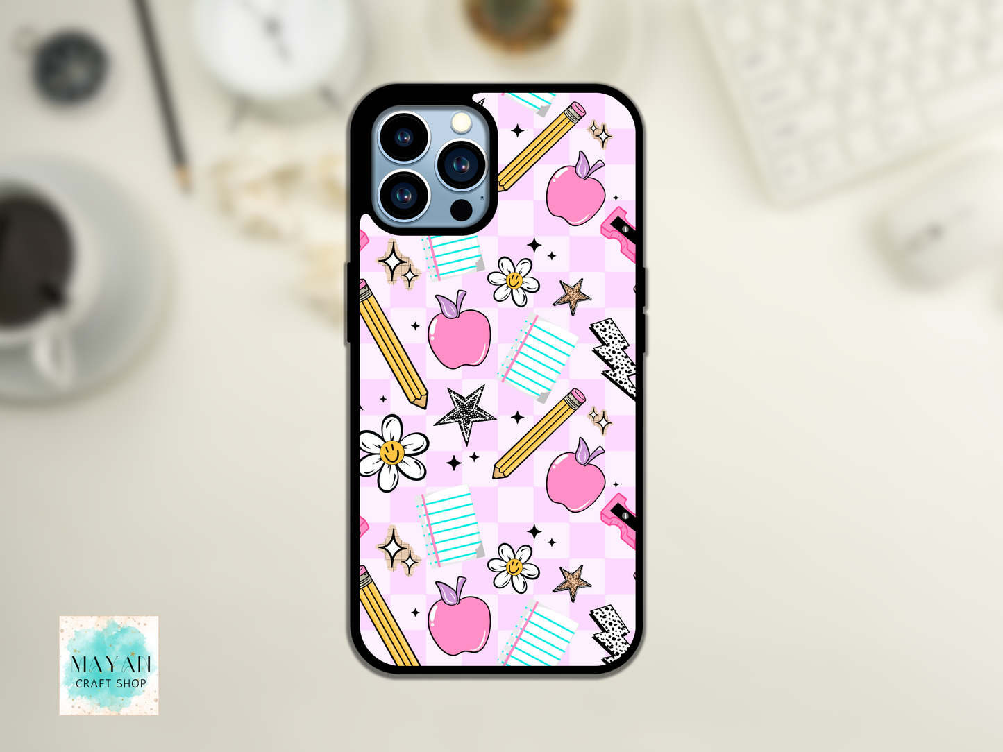 Phone case with school-themed design on a light background