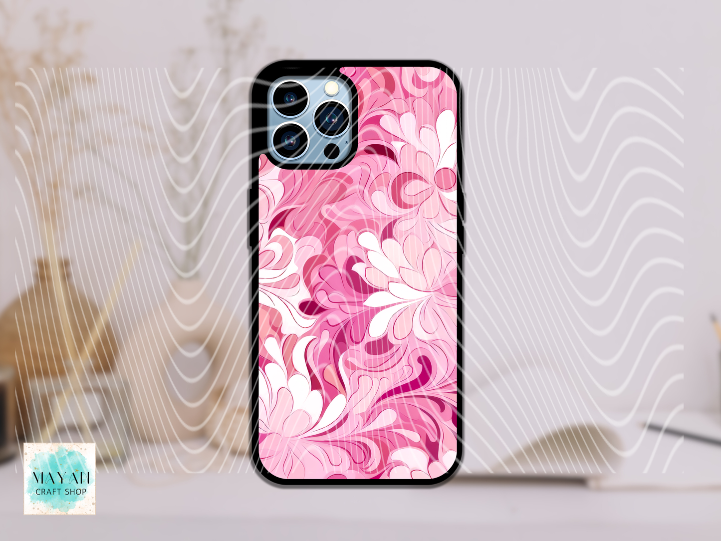 Phone case with pink floral design on a white background