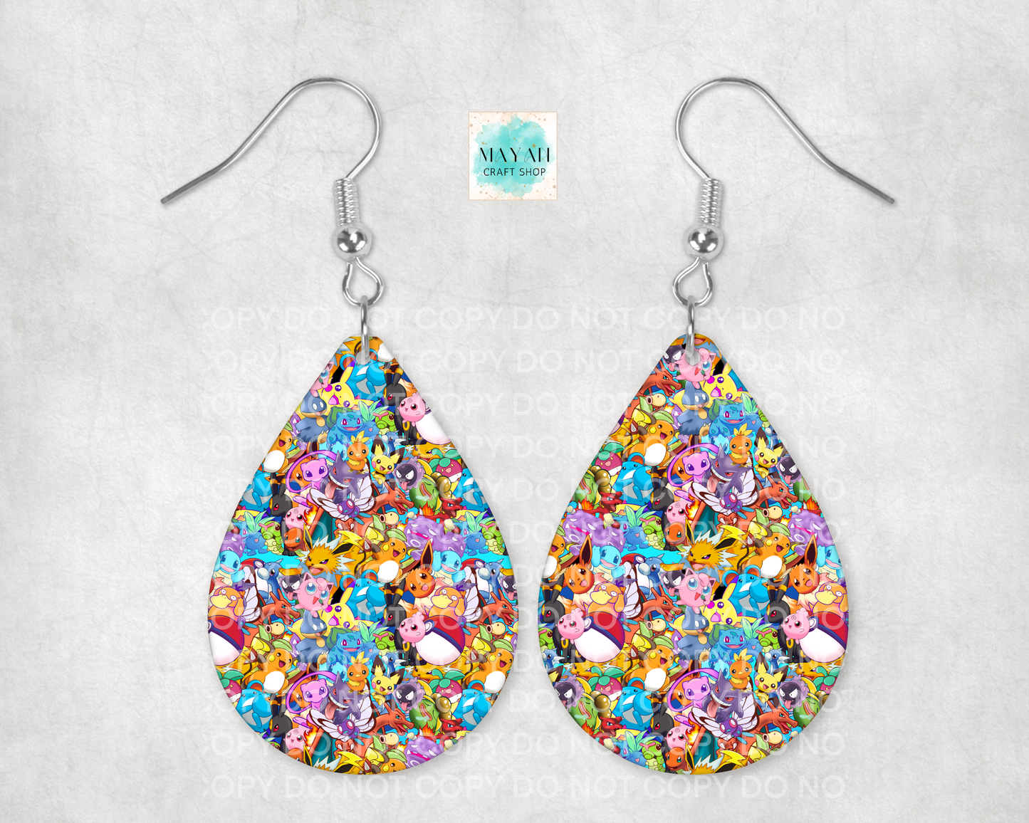 Colorful teardrop-shaped earrings on a light gray background