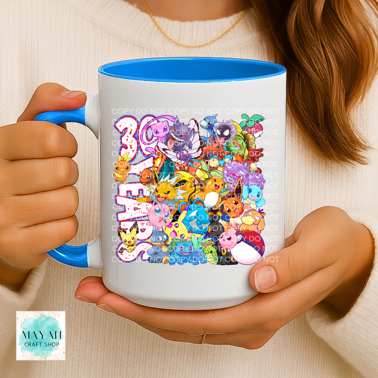 Person holding a mug with colorful character design and '30th Birthday' text.