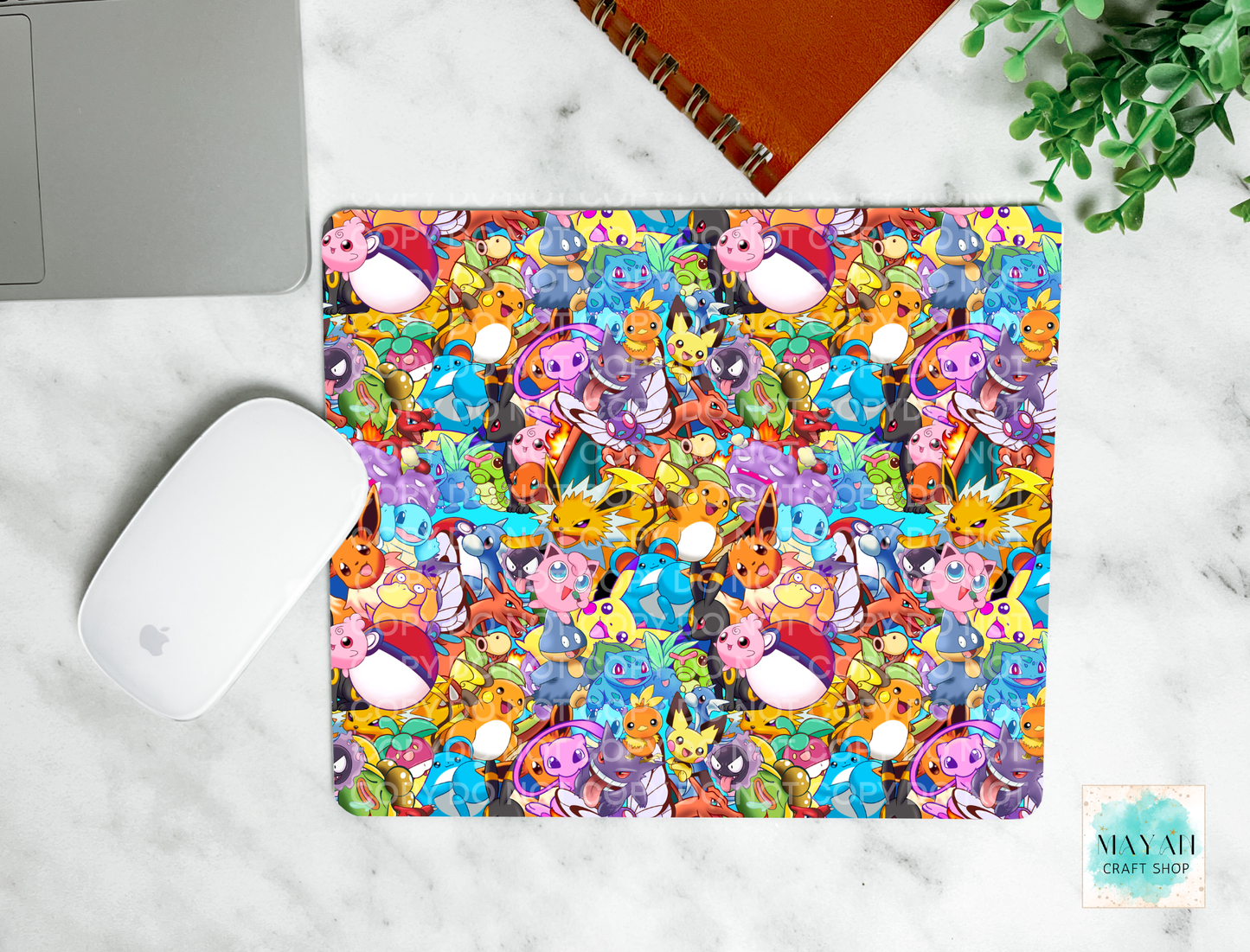 Colorful mouse pad with cartoon characters on a marble surface