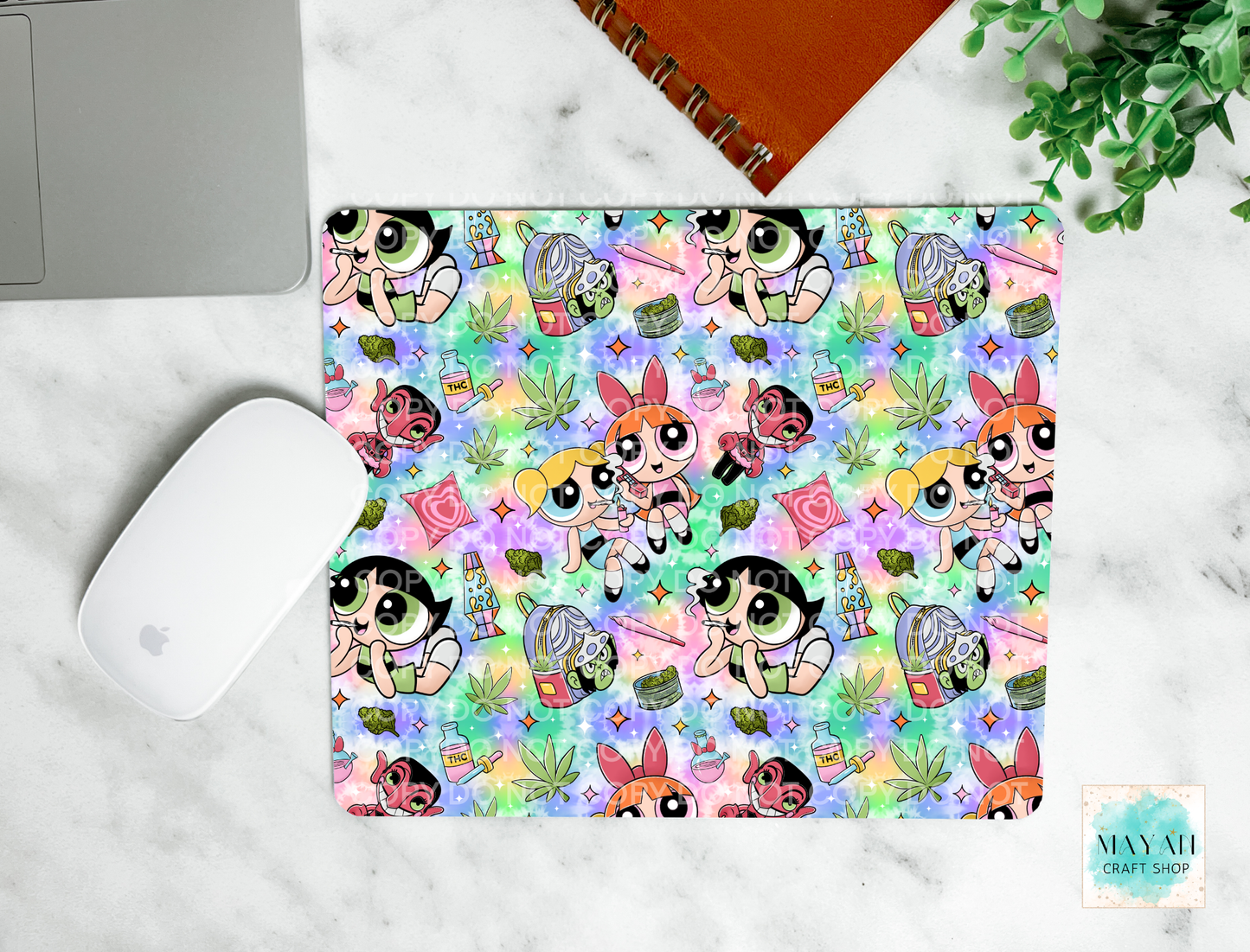 Colorful mouse pad with cartoon character pattern on a marble surface.