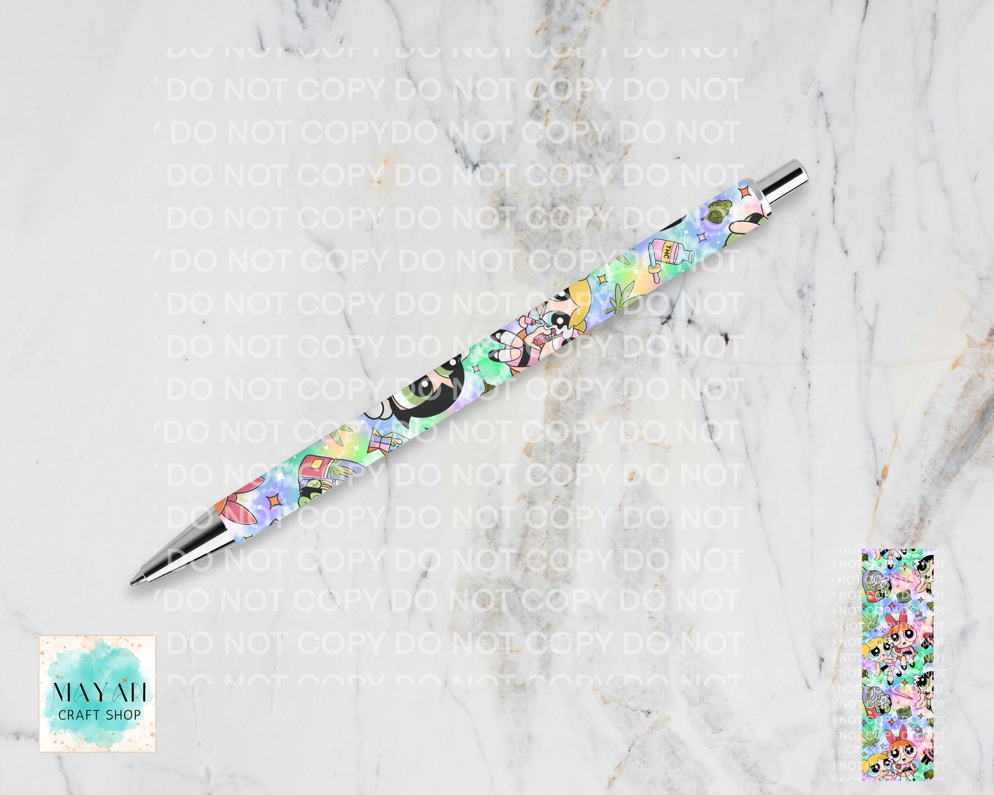 Decorative pen with floral design on a marble surface.