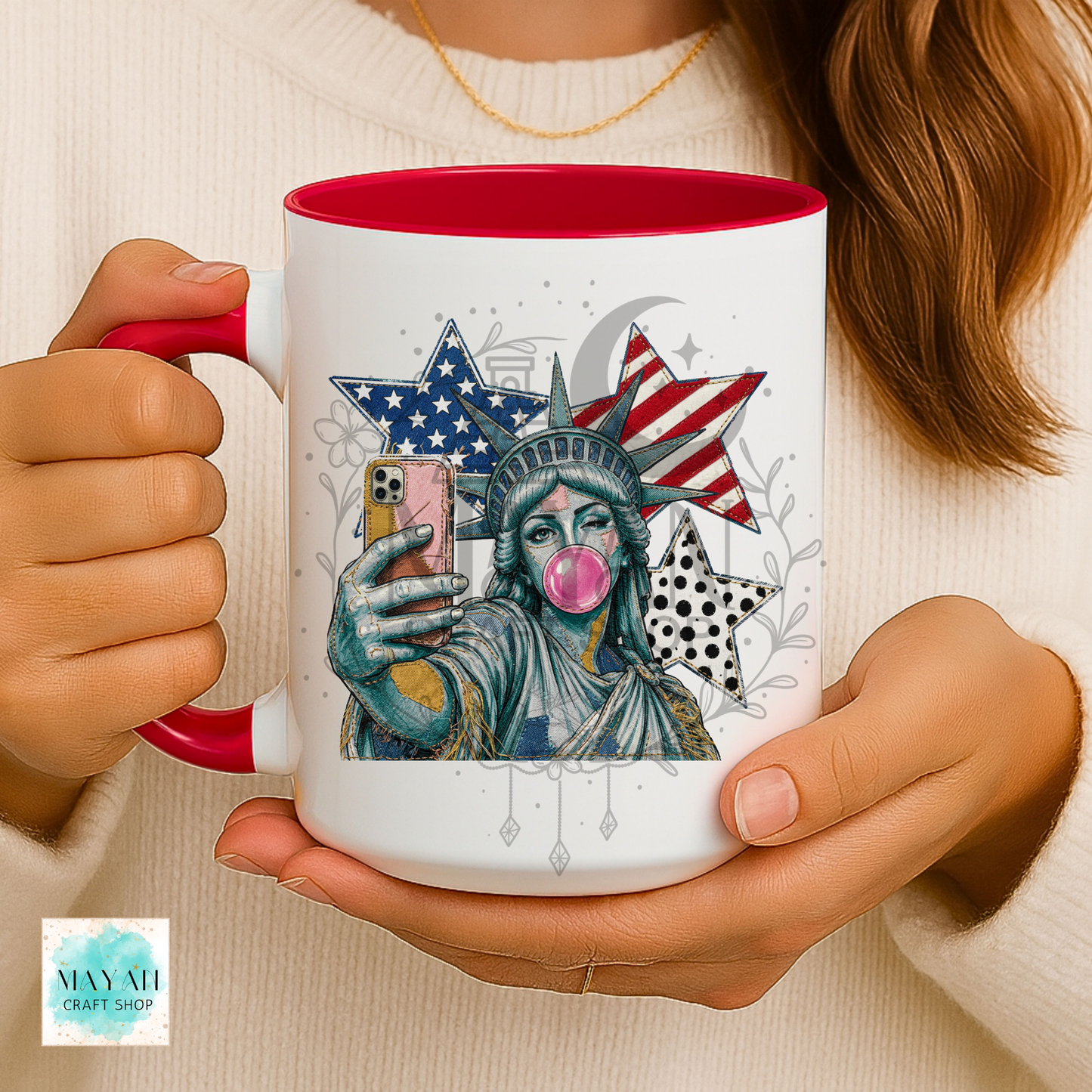 Person holding a mug with a unique design of the Statue of Liberty taking a selfie.