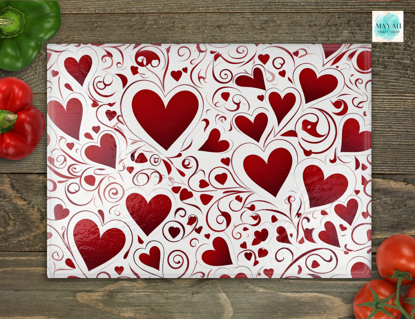 Cutting board with red heart pattern on a wooden surface