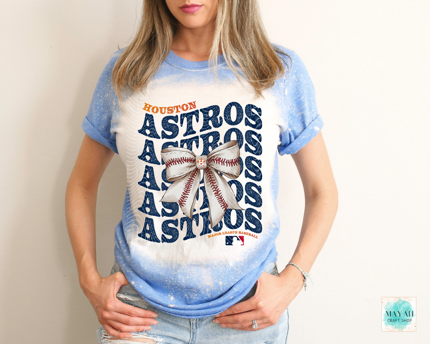 Houston baseball bow heather royal blue bleached tee. -Mayan Craft Shop