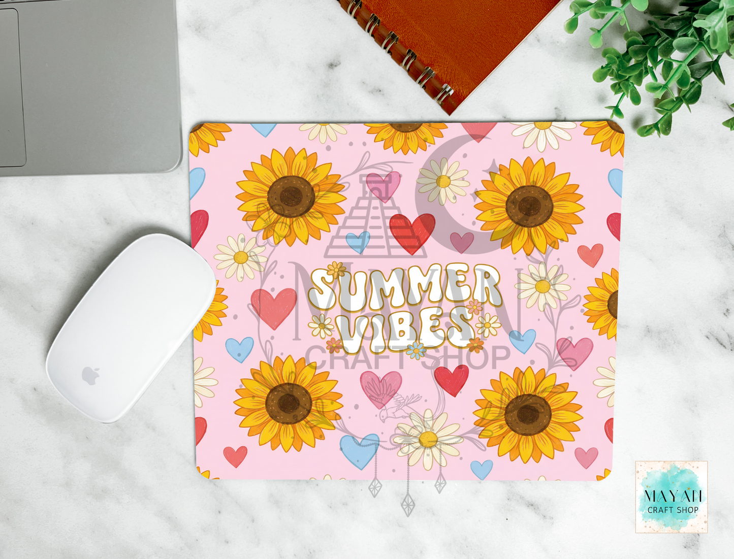 Mouse pad with sunflower design and 'Summer Vibes' text on a marble surface.