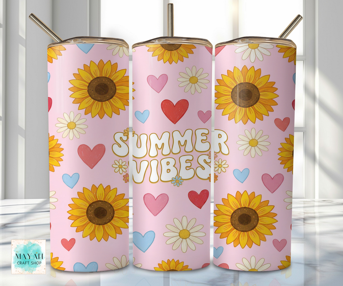 Three pink tumblers with sunflower and heart designs, featuring the text 'Summer Vibes'.