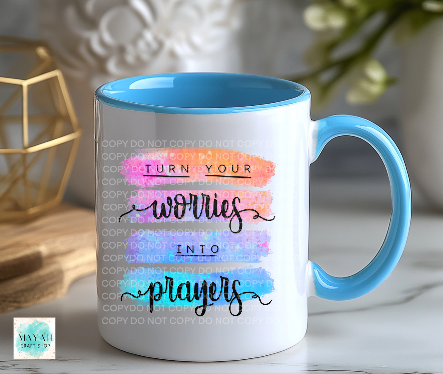 Mug with motivational quote and blue interior and handle on a blurred background
