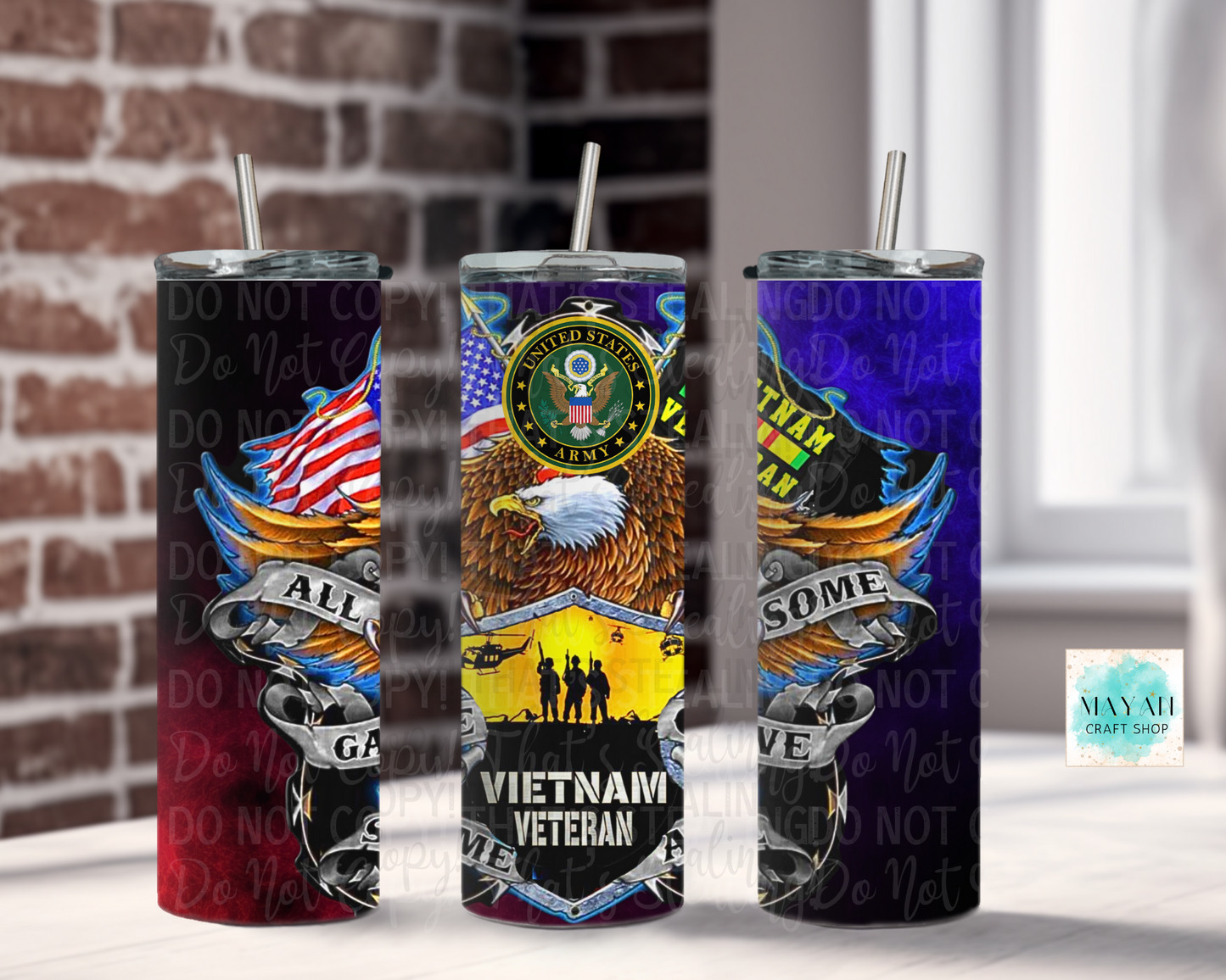Three tumblers with military-themed designs against a brick wall background.