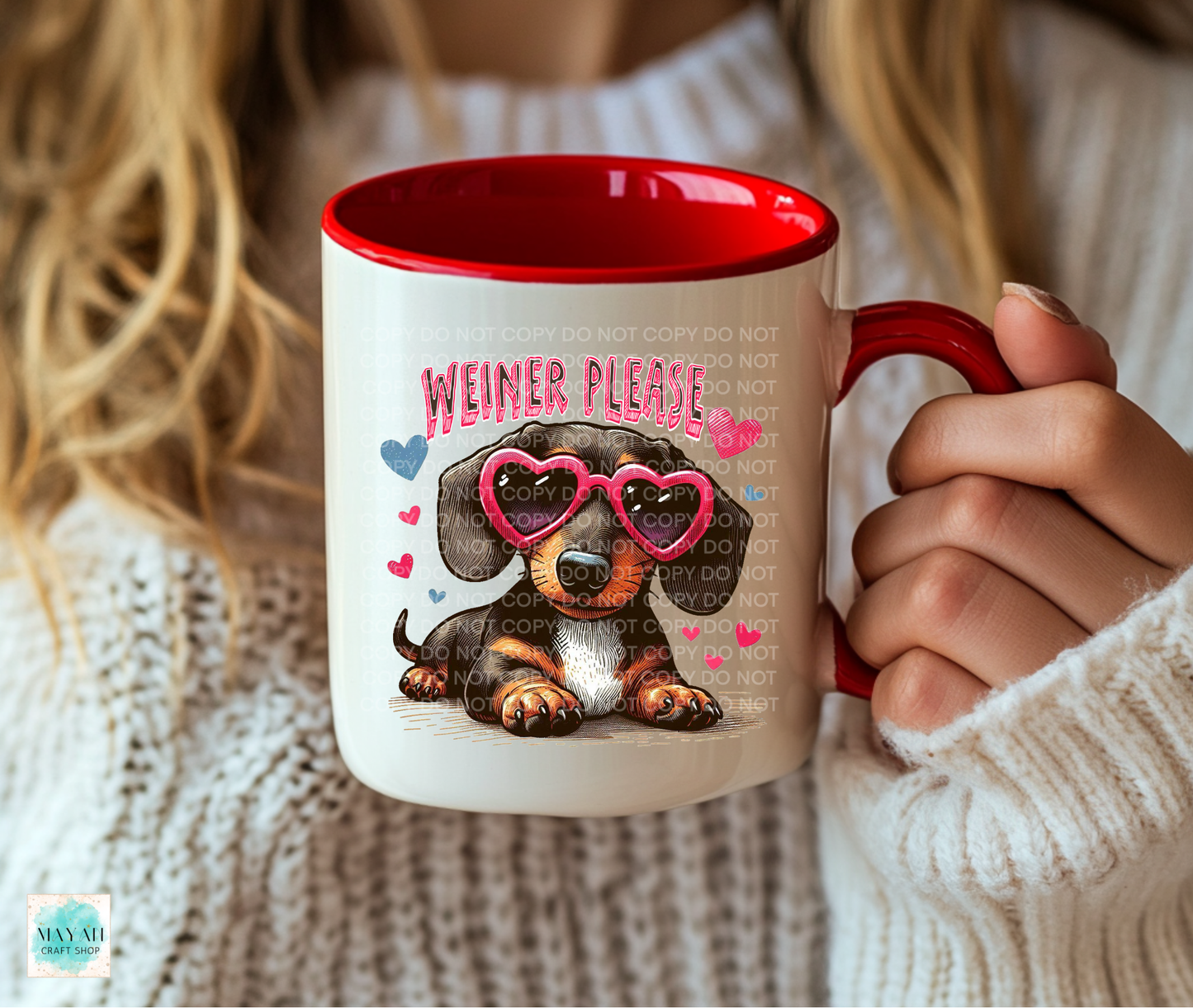Person holding a mug with a dachshund graphic and ' Weiner Please' text.