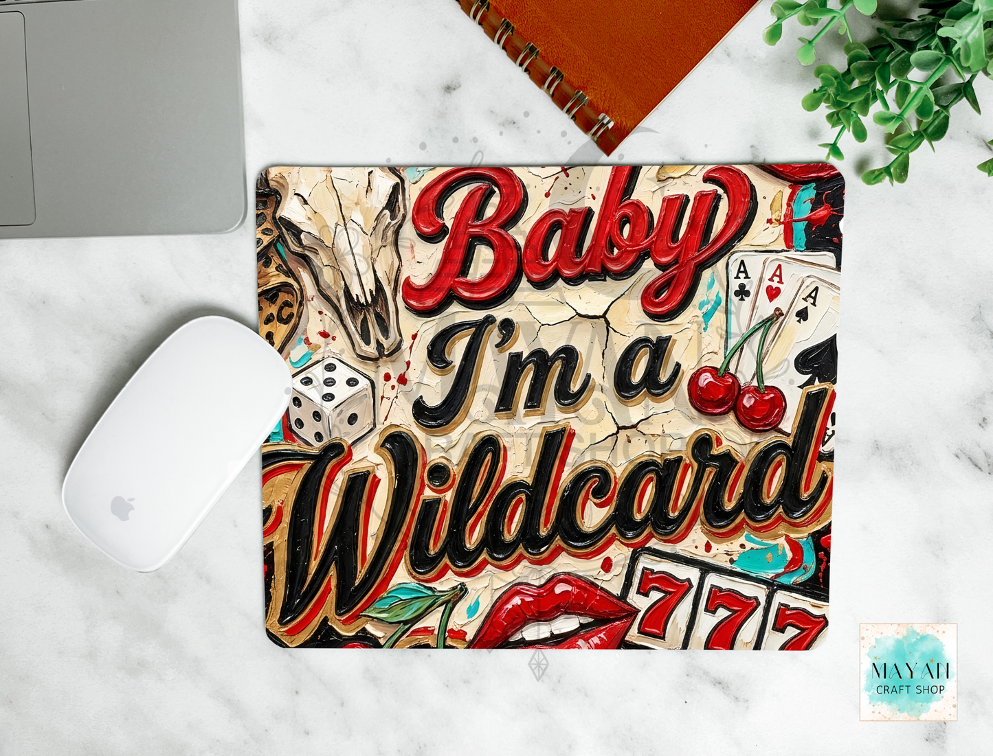 Mouse pad with 'Baby I'm a Wildcard' design on a marble surface