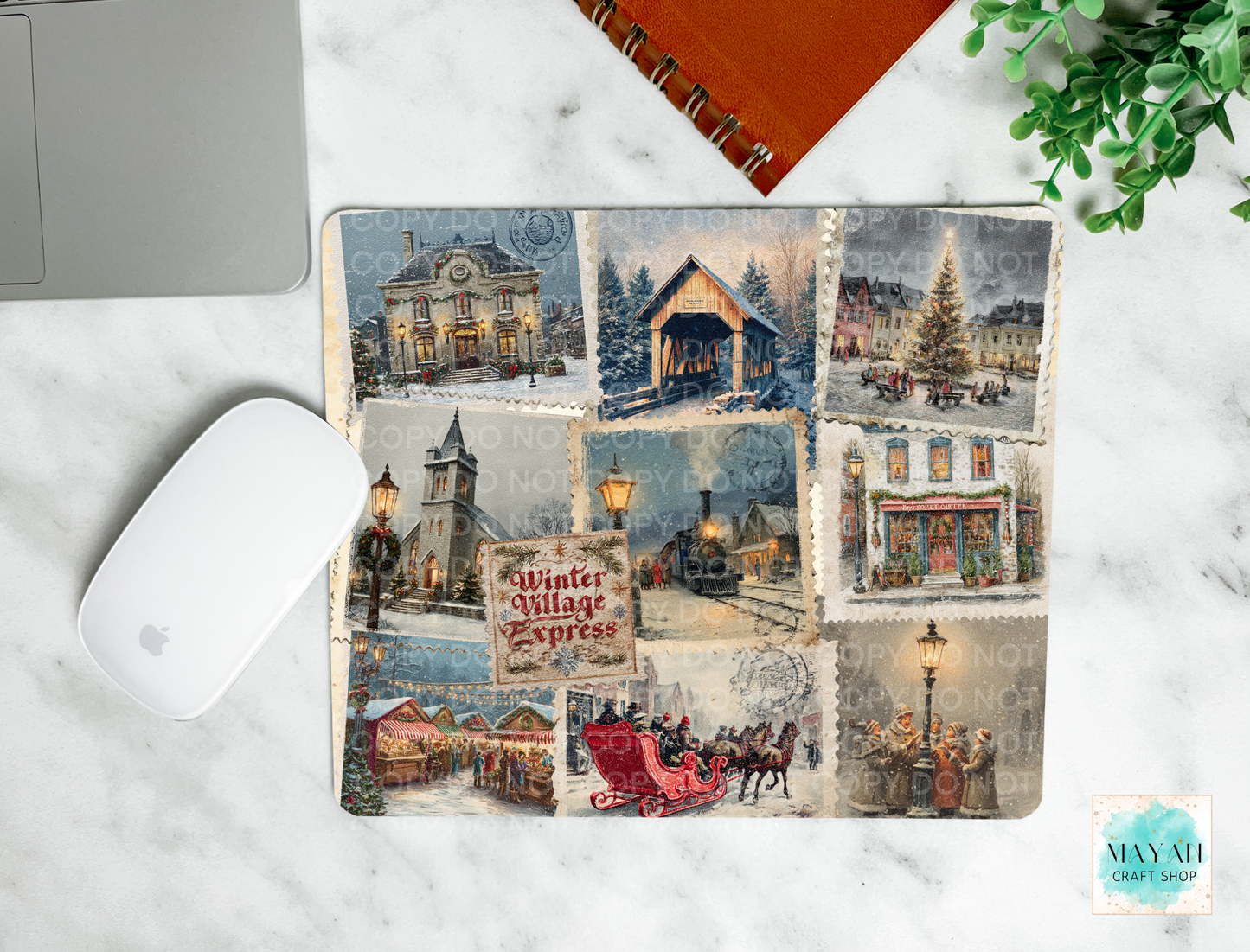 Christmas-themed mouse pad with vintage village design on a marble surface.