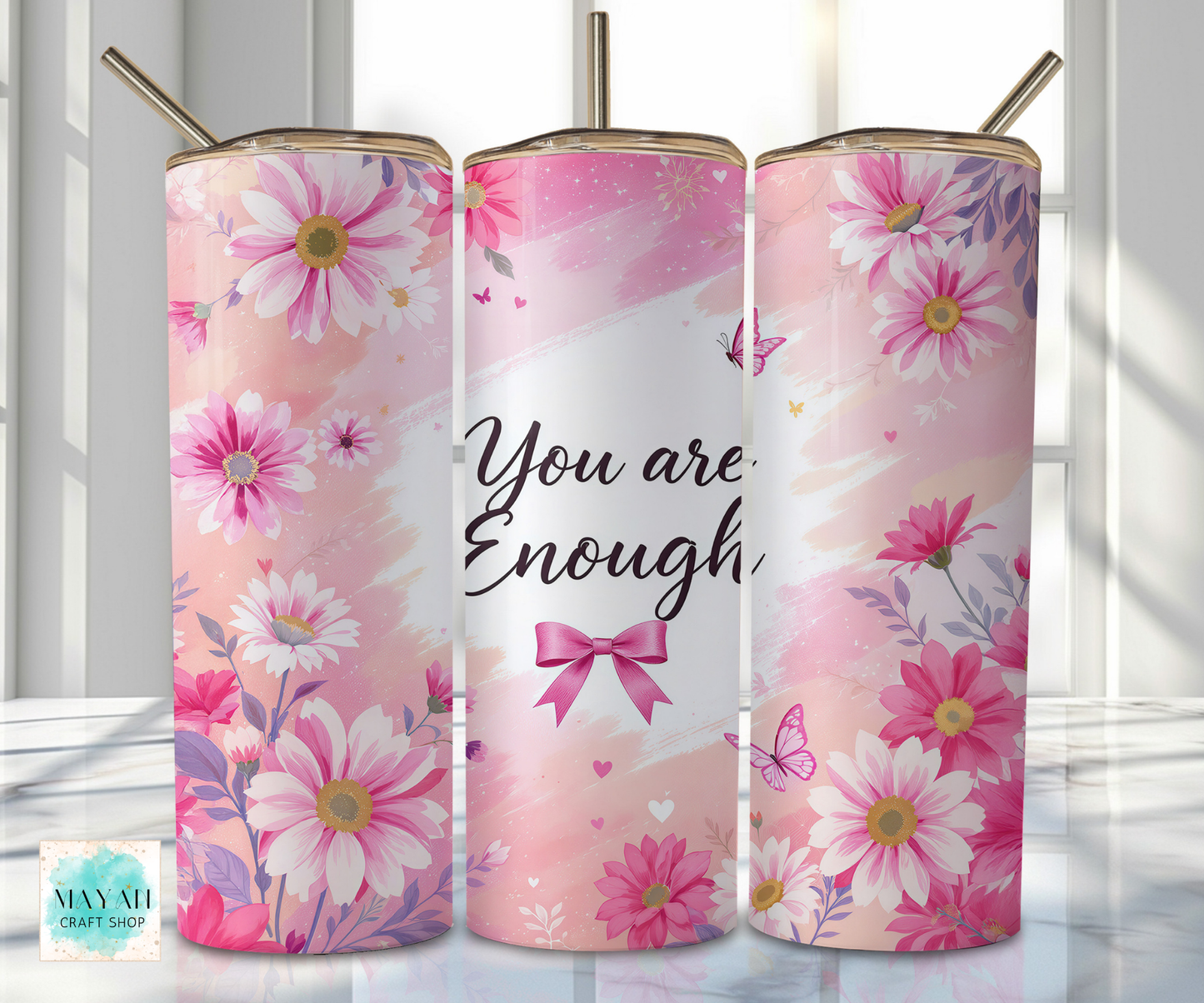 Three pink floral tumblers with 'You are Enough' text and a bow design.