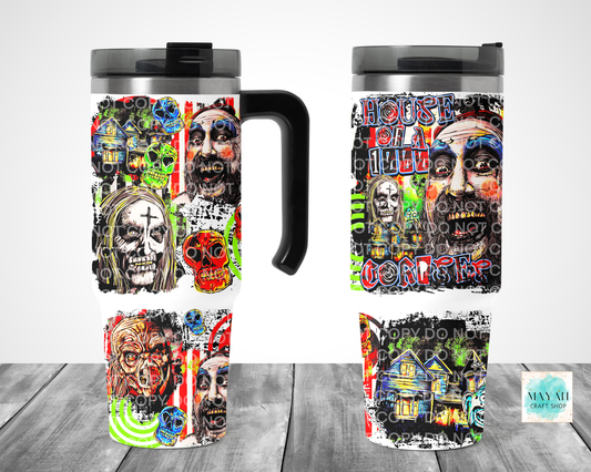 Two views of a stainless-steel travel tumbler with a black handle and lid, featuring a highly detailed, colorful horror-themed graphic print of zombie faces, skulls, on a white background.