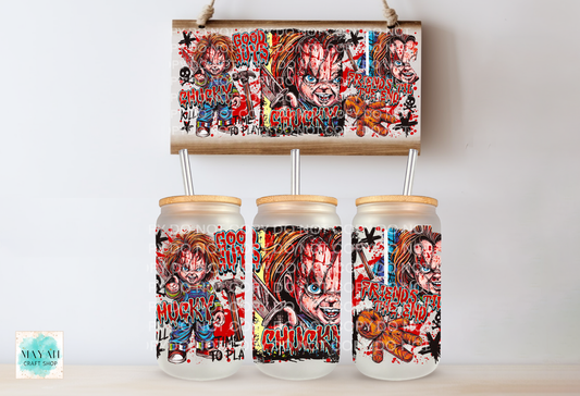 Three frosted glass mason jar tumblers with bamboo lids and metal straw inserts, each printed with a colorful horror character collage, shown below a matching rectangular print on a light wall.