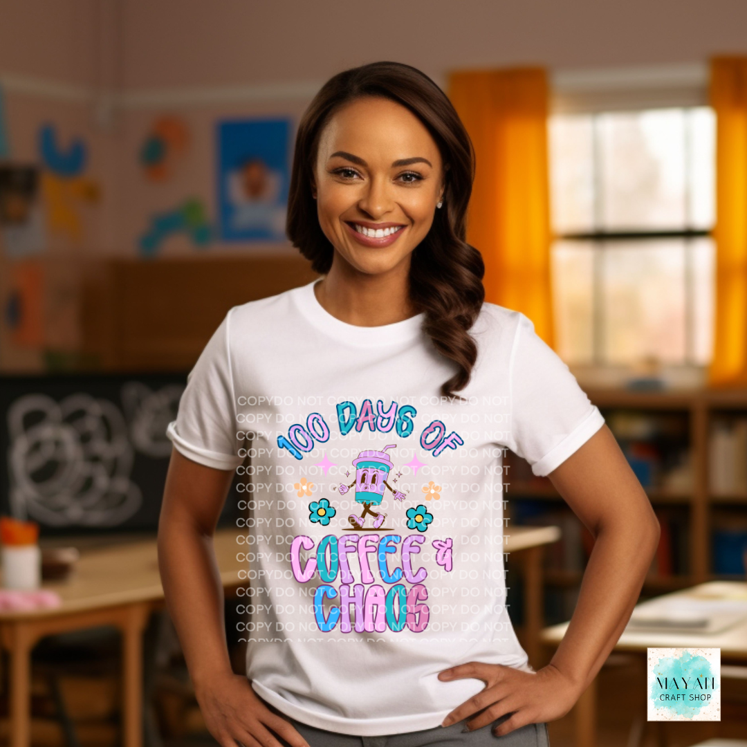 Person wearing a white t-shirt with colorful text in a classroom setting