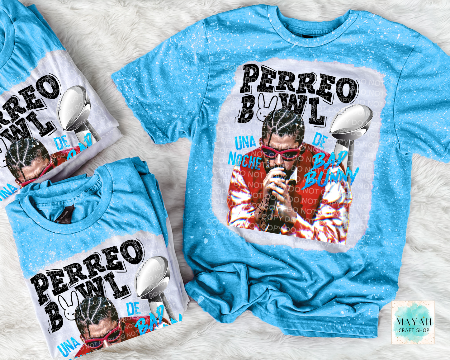 Blue t-shirt with graphic design and text on a textured surface