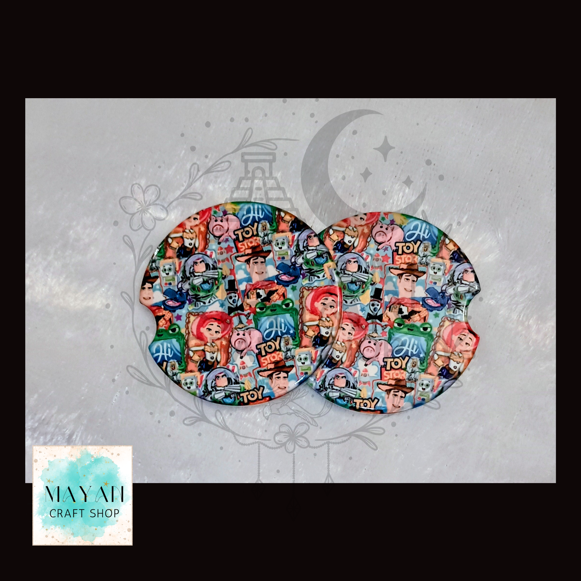 Colorful mouse pads with character designs on a decorative background.