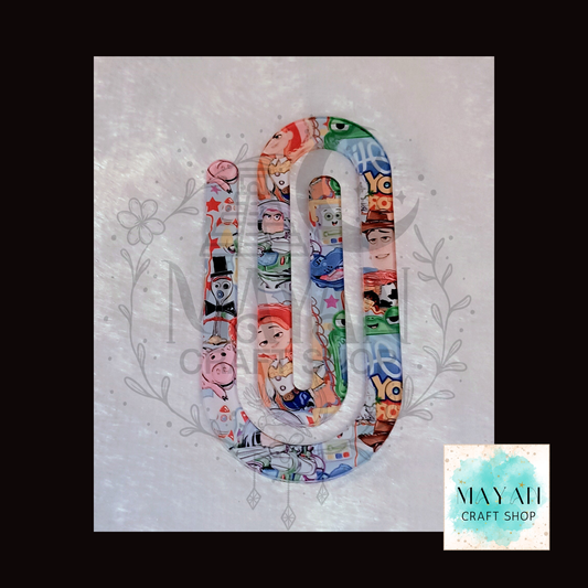 Colorful jumbo clip with cartoon characters on a textured white background.