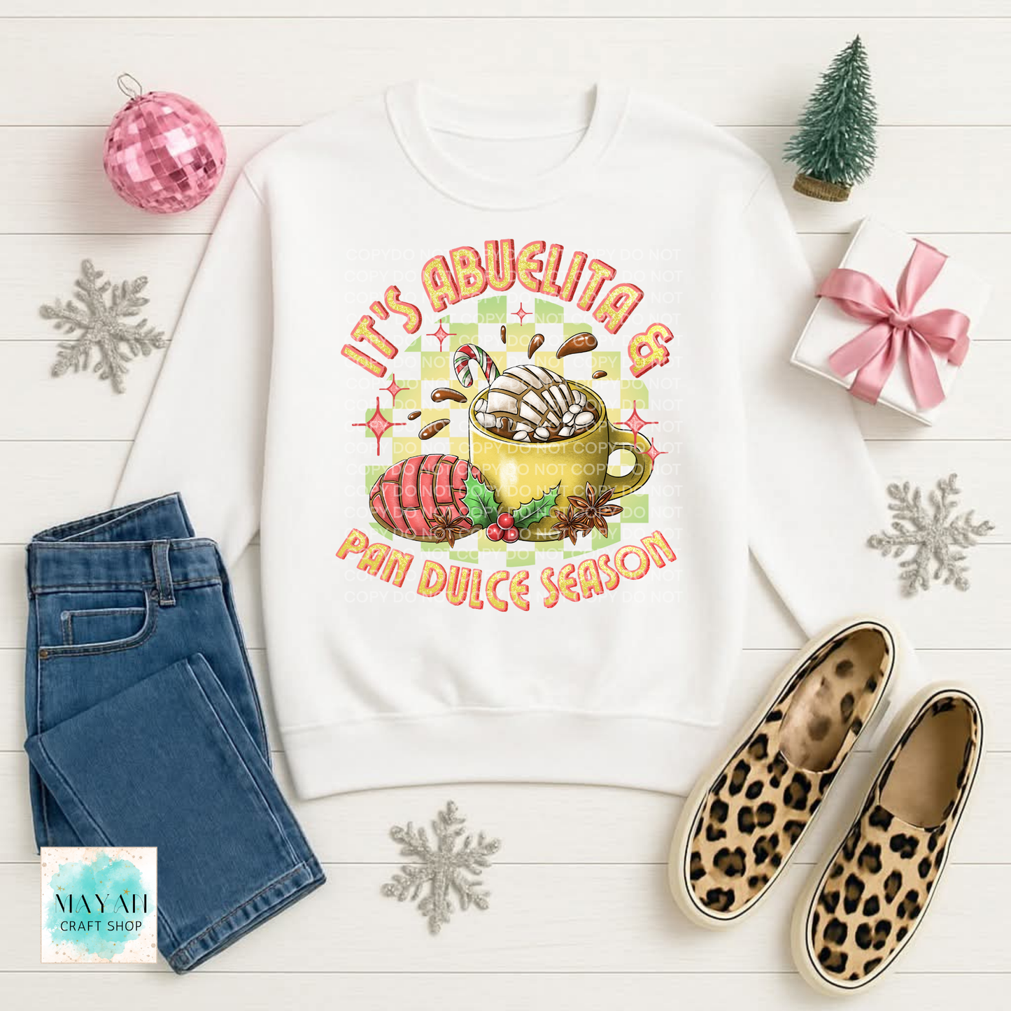 Sweatshirt with pan dulce and a coffee.