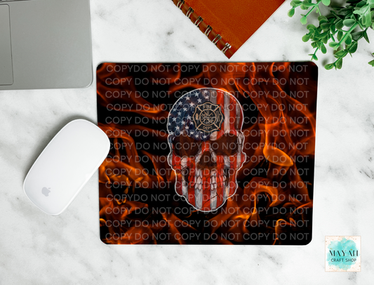 American flag skull design on a mouse pad placed on a marble surface.