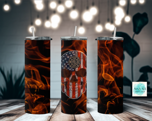 Three insulated tumblers with flame design and American flag skull on a wooden surface.